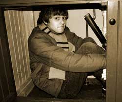 Hiding under the sink as in Christmas Story